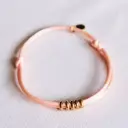 Satijnen armband met ringen zalm goudkleurig - Bazou